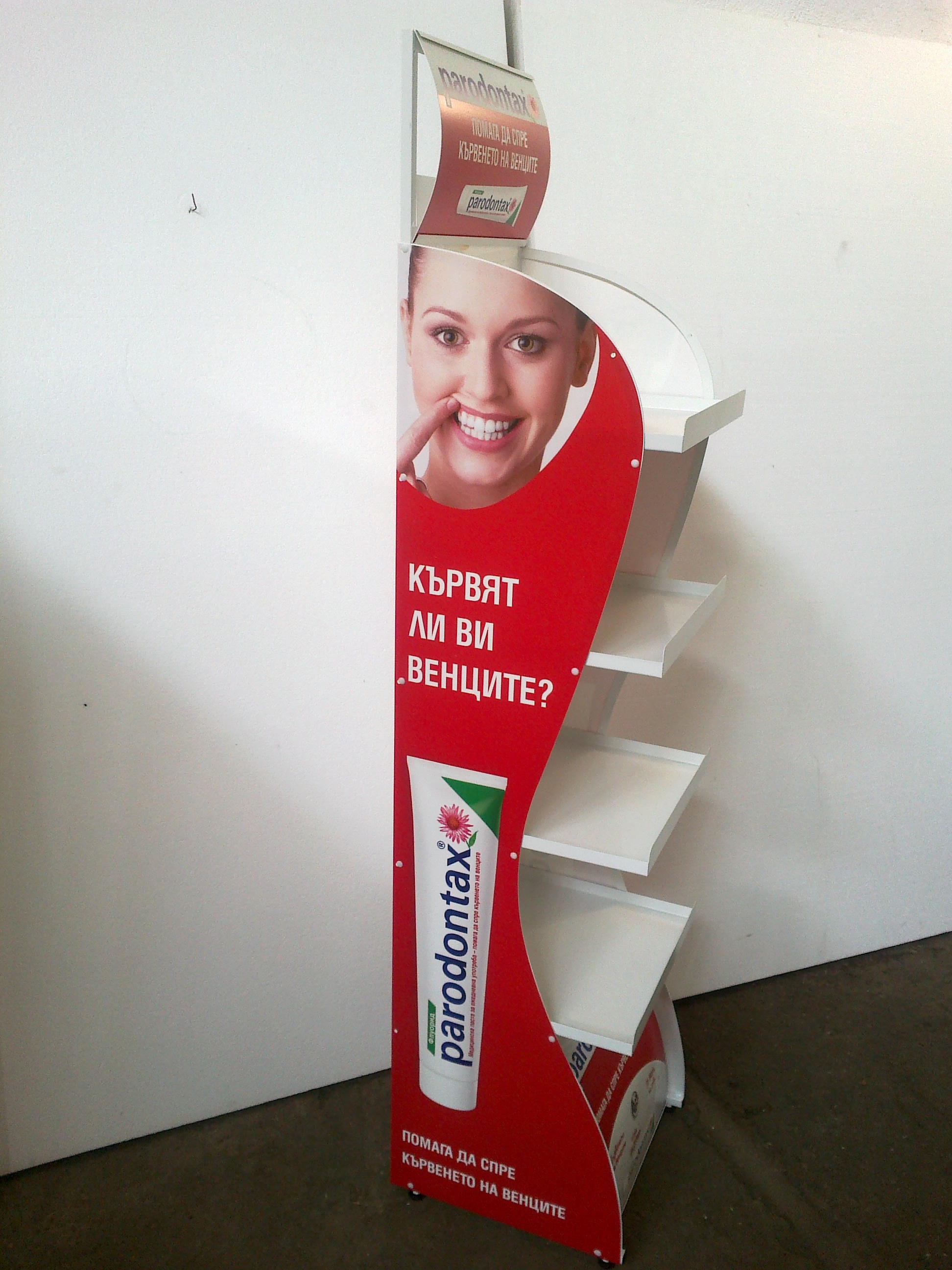 Advertising rack for toothpaste branded with the company logo of Parodontax